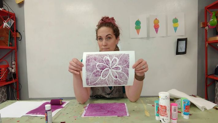 Apply ink or paint to a smooth surface
